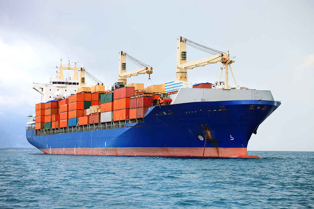stock-photo-cargo-container-ship-in-mediterranean-coast-101212576